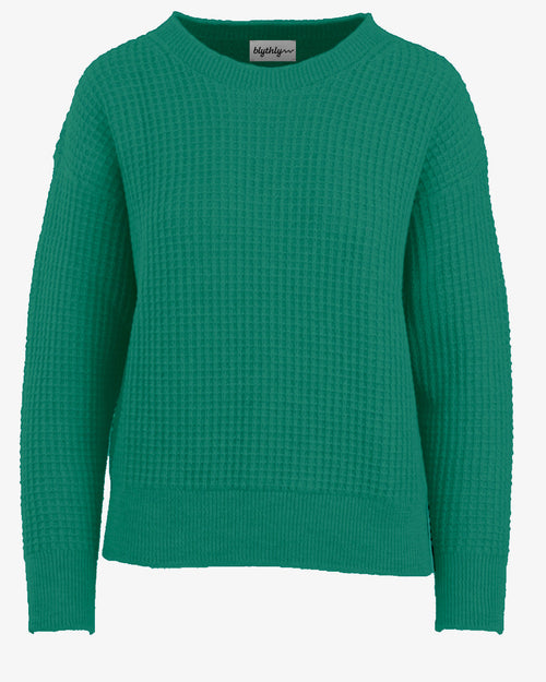 Teal green USA made sweater on a white background
