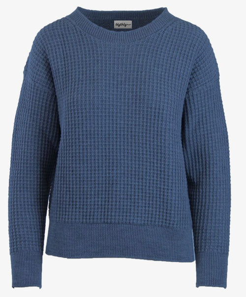 Blue textured sweater on a white background