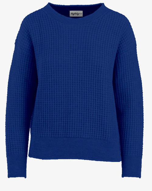Blue textured USA made sweater on a white background